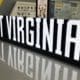 West Virginia sign at WVU Football facility stock