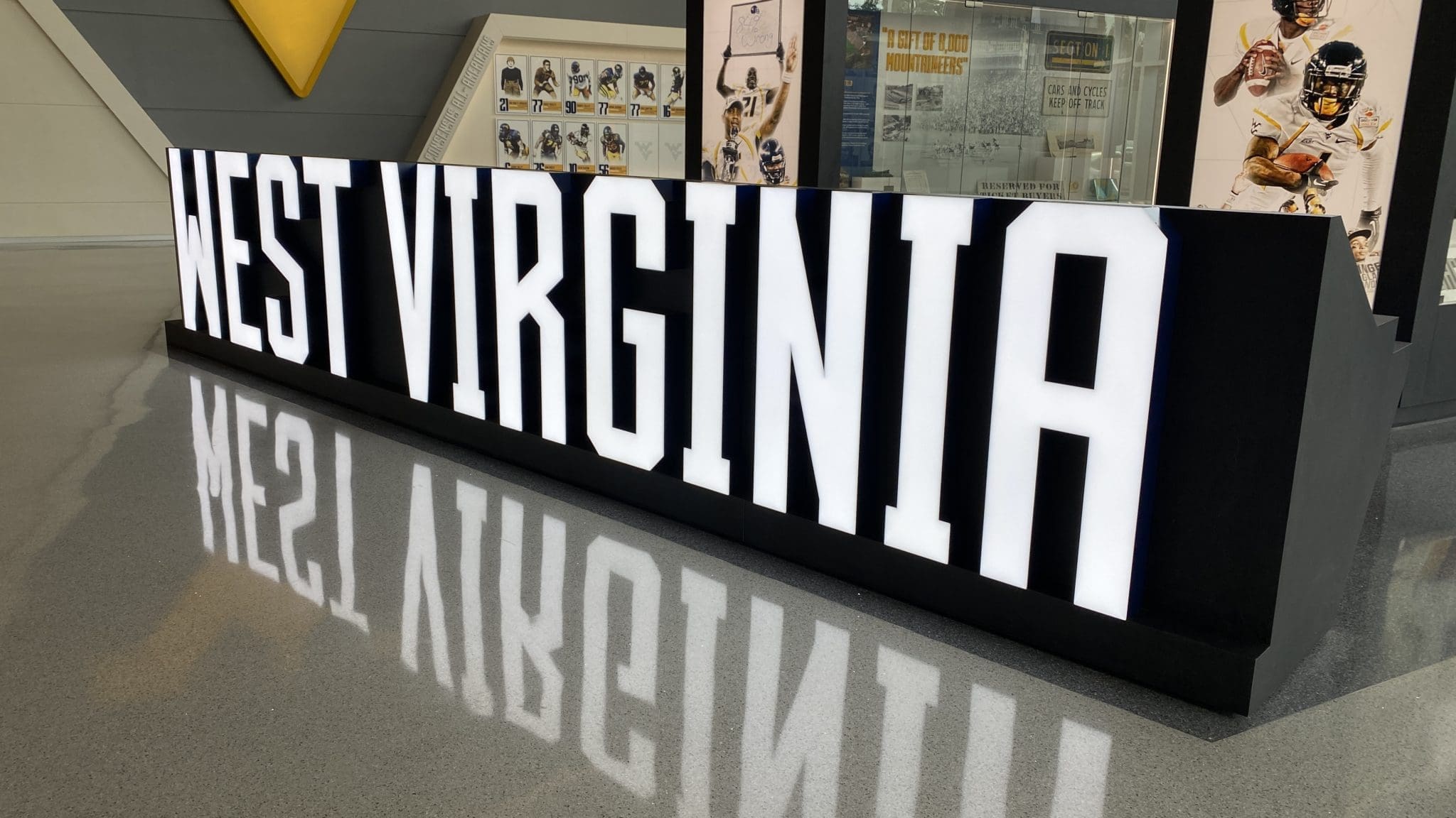 West Virginia sign at WVU Football facility stock
