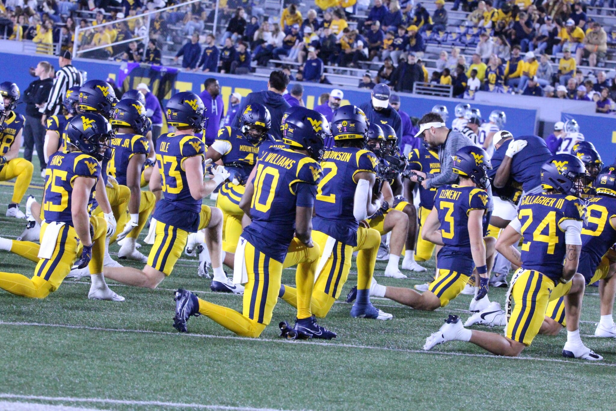 WVU Football team stretching