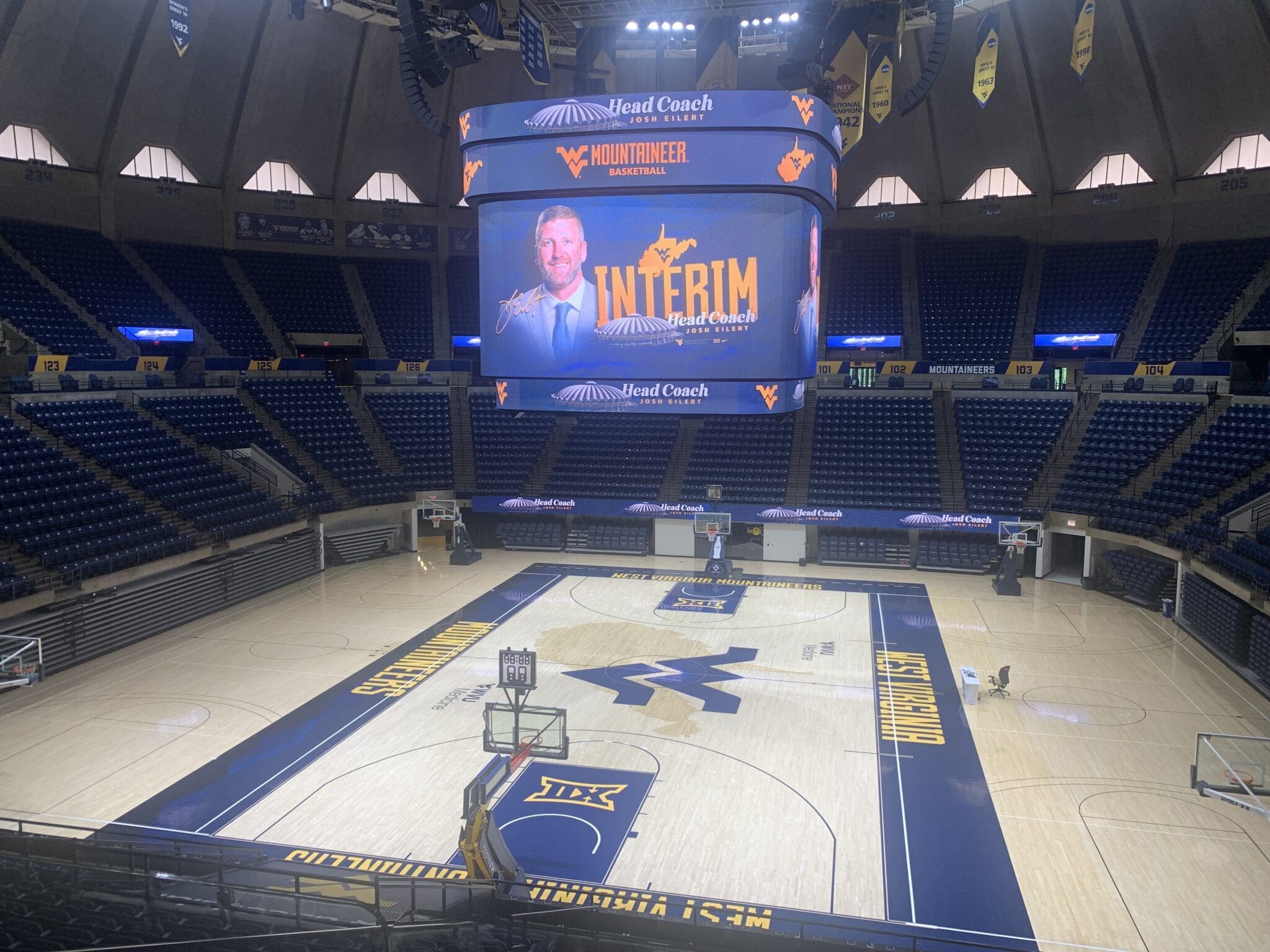 WVU Basketball Interim HC Josh Eilert graphic at WVU Coliseum