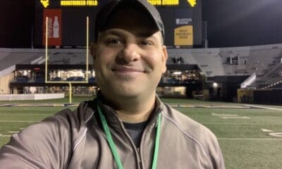 Mike Asti on WVU field at Milan Puskar Stadium