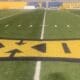 Big 12 logo on WVU football field stock