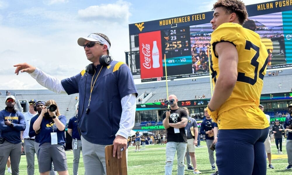 WVU Football HC Neal Brown presents spring award winner