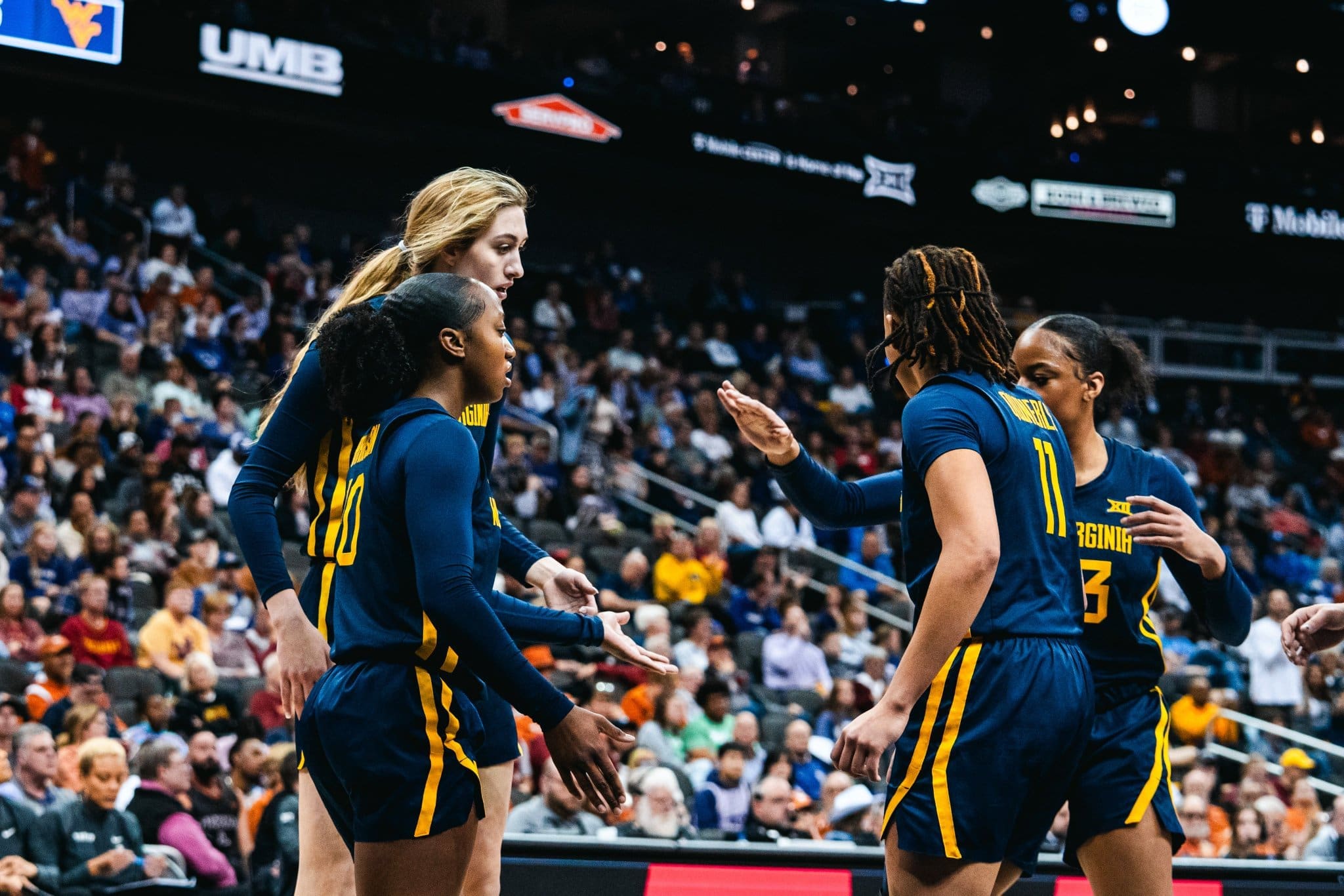 WVU Women's Basketball team huddle during Big 12 Tournament