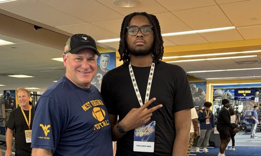 WVU Football HC Rich Rodriguez with Tyrie Davis-Winn