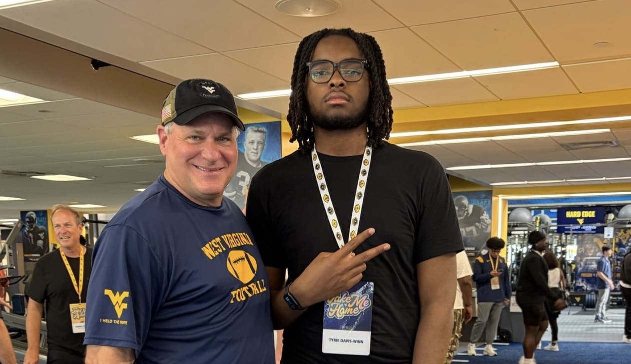 WVU Football HC Rich Rodriguez with Tyrie Davis-Winn