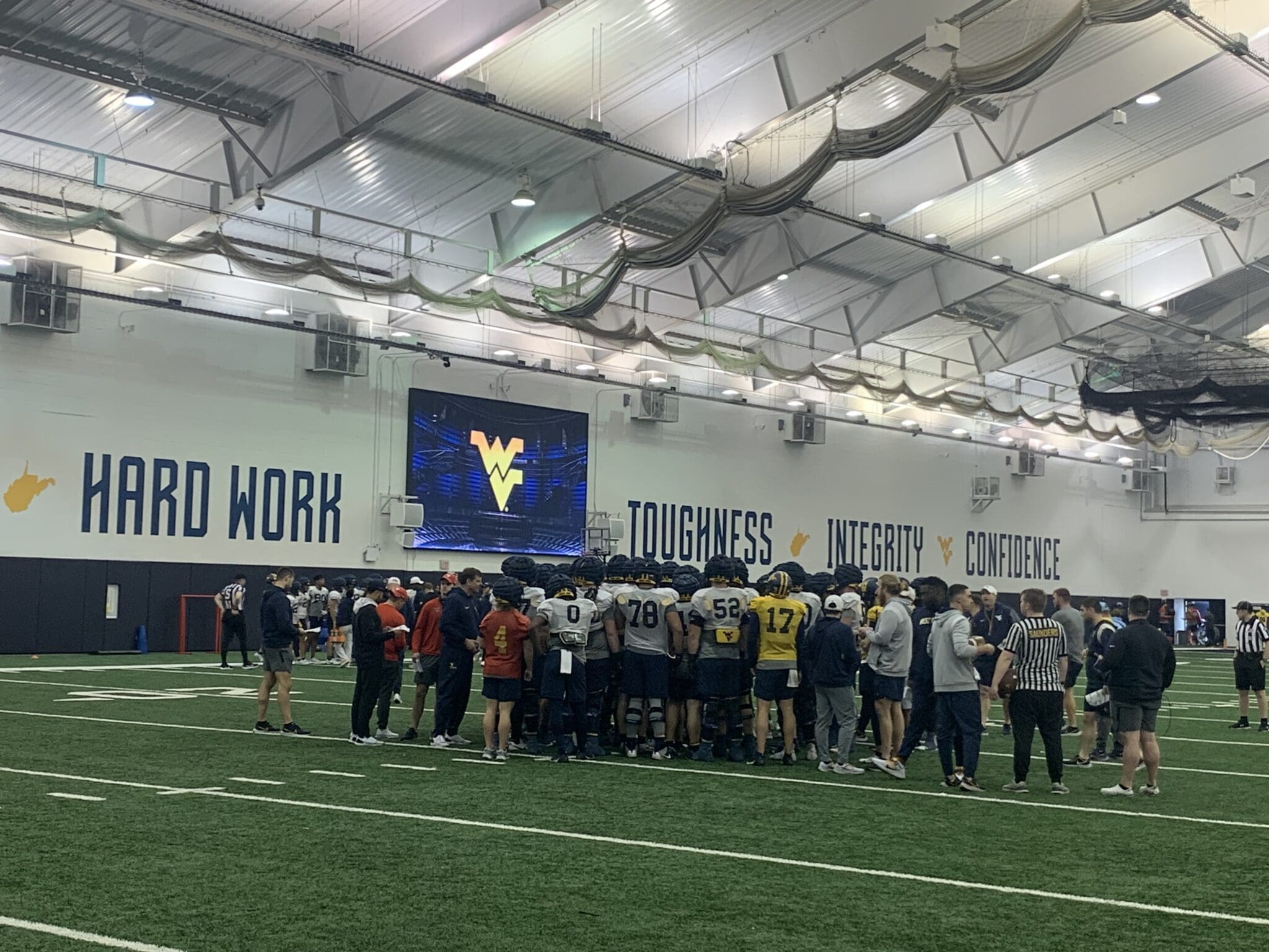 WVU Football spring practice at indoor facility stock