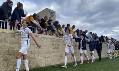 WVU men's soccer celebrates with fans