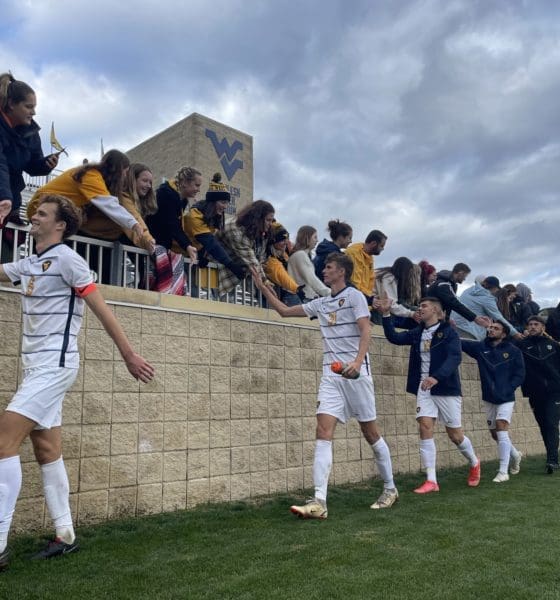 WVU men's soccer celebrates with fans