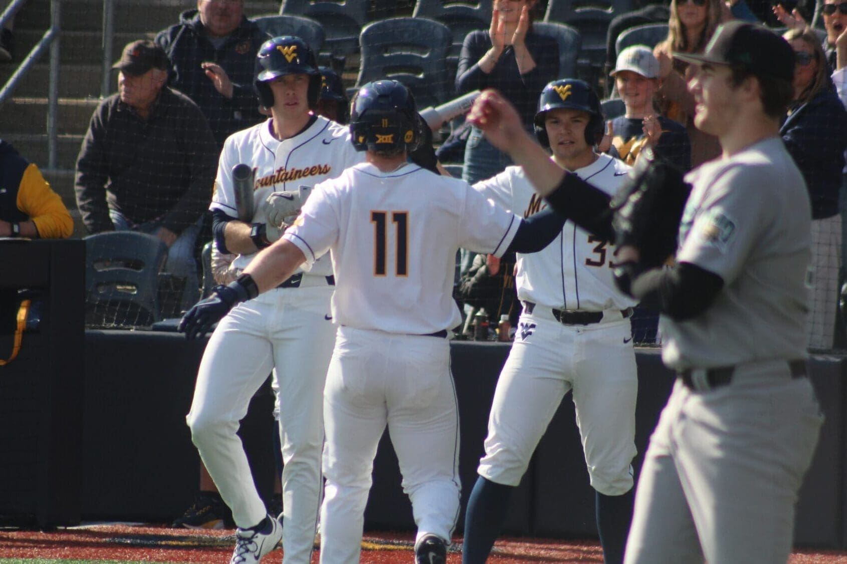 WVU Baseball Sam White celebrates