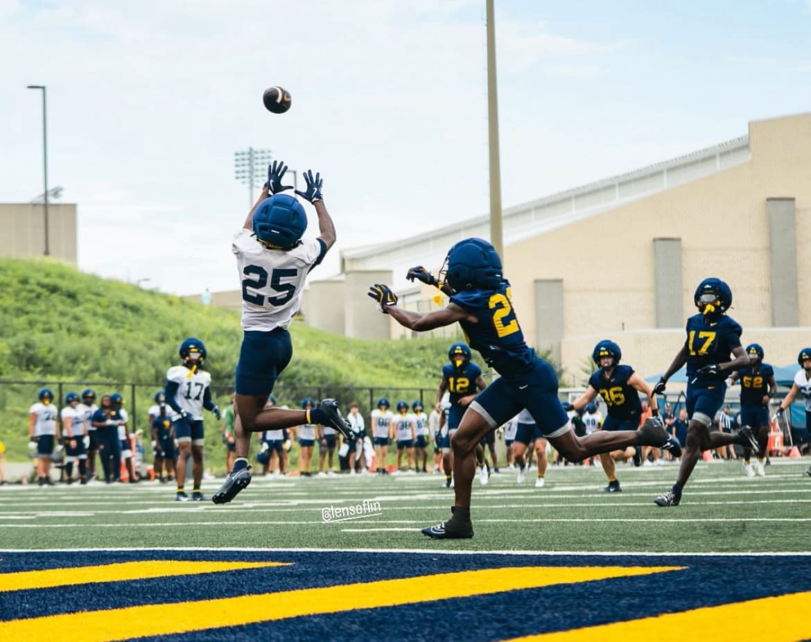WVU Football freshman receiver Armoni Weaver leaps for a catch. WVU Athletics/Taylin Long