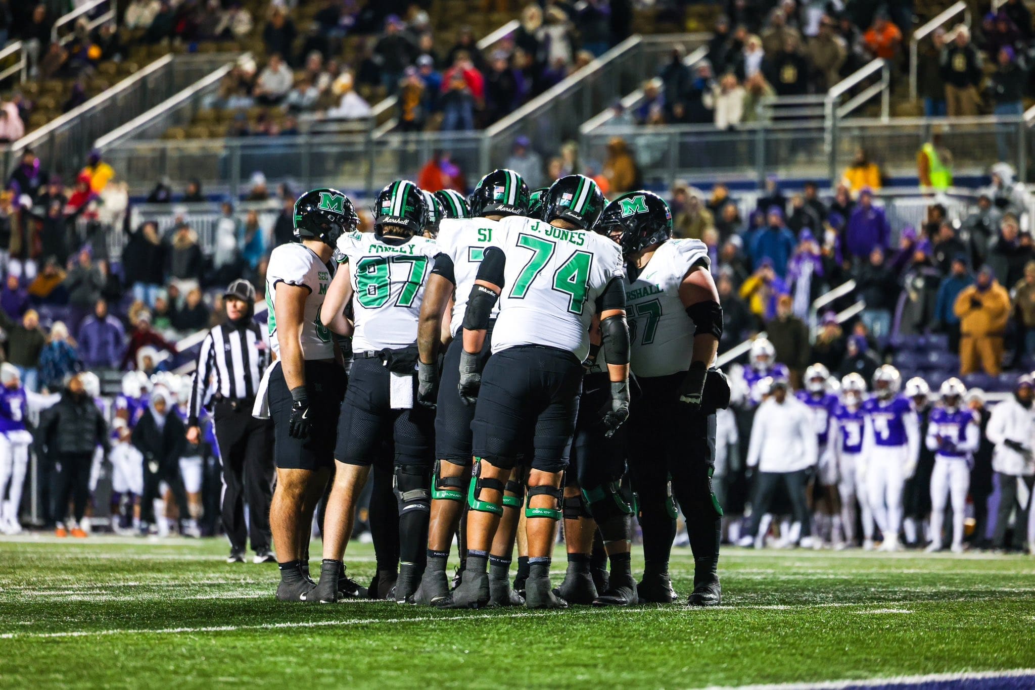 Marshall Football huddle