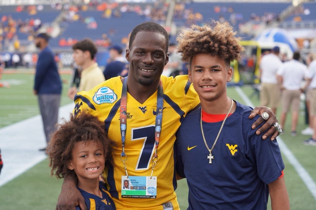 WVU Football coach and legend Noel Devine with sons