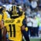 WVU returner Beanie Bishop Jr. after fair catching a punt against UNC in the Duke's Mayo Bowl at Bank of America Stadium in Charlotte, N.C. on Dec. 27, 2023. (Mitchell Northam / WV Sports Now)