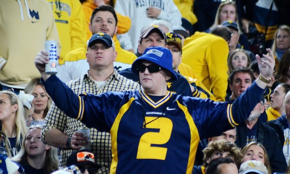 WVU football fans cheer at the Duke's Mayo Bowl on Dec. 27, 2023 at Bank of America Stadium in Charlotte, N.C. (Mitchell Northam / WV Sports Now)