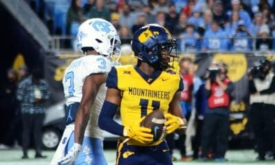 WVU returner Beanie Bishop Jr. after fair catching a punt against UNC in the Duke's Mayo Bowl at Bank of America Stadium in Charlotte, N.C. on Dec. 27, 2023. (Mitchell Northam / WV Sports Now)
