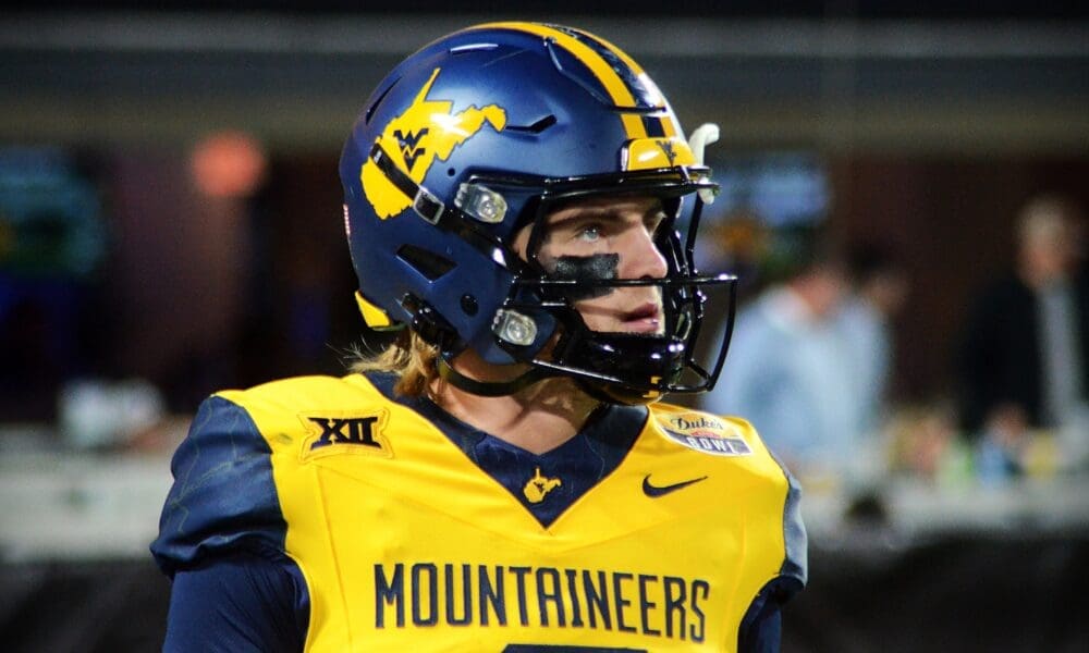 WVU Football quarterback Garrett Greene prepares to take a snap against UNC in the Duke's Mayo Bowl at Bank of America Stadium in Charlotte, N.C. on Dec. 27, 2023. (Mitchell Northam / WV Sports Now)