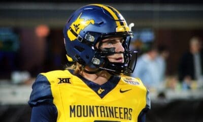 WVU Football quarterback Garrett Greene prepares to take a snap against UNC in the Duke's Mayo Bowl at Bank of America Stadium in Charlotte, N.C. on Dec. 27, 2023. (Mitchell Northam / WV Sports Now)