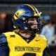 WVU Football quarterback Garrett Greene prepares to take a snap against UNC in the Duke's Mayo Bowl at Bank of America Stadium in Charlotte, N.C. on Dec. 27, 2023. (Mitchell Northam / WV Sports Now)