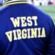 A WVU fan wears a Homefield jacket at the Duke's Mayo Bowl on Dec. 27, 2023 at Bank of America Stadium in Charlotte, N.C. (Mitchell Northam / WV Sports Now)