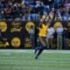 WVU Football linebacker Tyrin Bradley celebrates his third quarter interception against UNC at the Duke's Mayo Bowl on Dec. 27, 2023, at Bank of America Stadium in Charlotte, N.C. (Mitchell Northam / WV Sports Now)