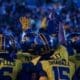 WVU Football players huddle up before the fourth quarter against UNC at the Duke's Mayo Bowl on Dec. 27, 2023, at Bank of America Stadium in Charlotte, N.C. (Mitchell Northam / WV Sports Now)