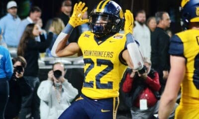 WVU running back Jahiem White celebrates his touchdown against UNC in the Duke's Mayo Bowl at Bank of America Stadium in Charlotte, N.C. on Dec. 27, 2023. (Mitchell Northam / WV Sports Now)