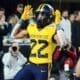 WVU running back Jahiem White celebrates his touchdown against UNC in the Duke's Mayo Bowl at Bank of America Stadium in Charlotte, N.C. on Dec. 27, 2023. (Mitchell Northam / WV Sports Now)
