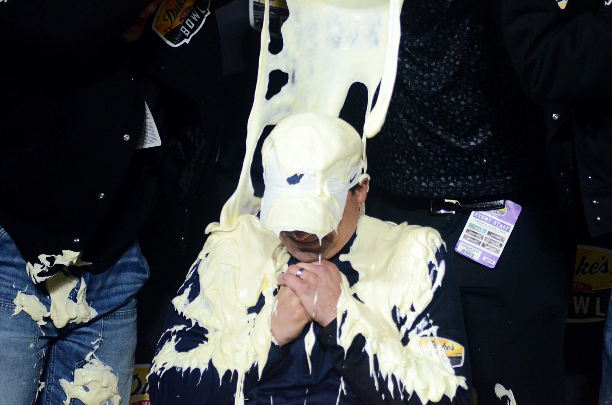 WVU head coach Neal Brown gets a mayo bath after beating UNC in the Duke's Mayo Bowl at Bank of America Stadium in Charlotte, N.C. on Dec. 27, 2023. (Mitchell Northam / WV Sports Now)
