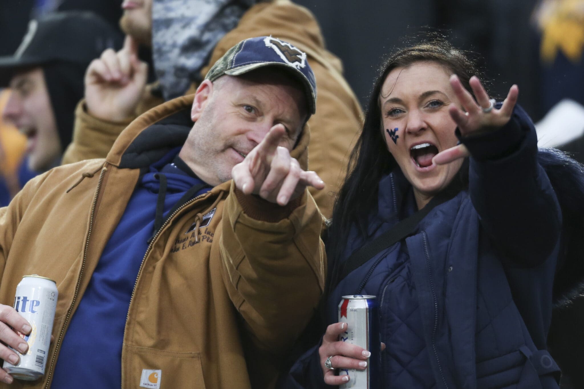 WVU fans holding beer at UCF win