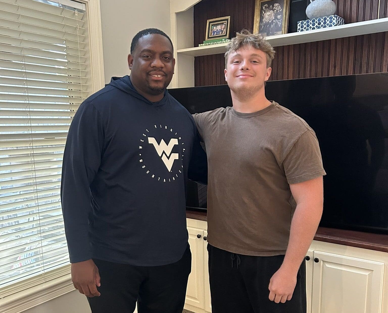 WVU Football DL coach William Green with Carter Napier
