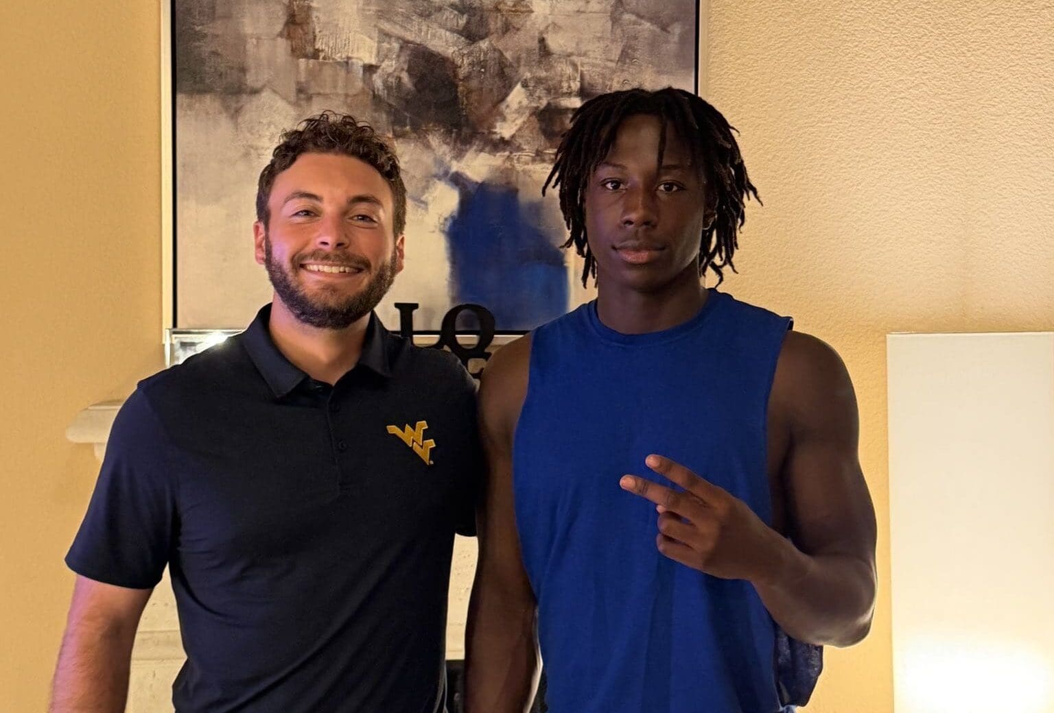 WVU Football QB Coach Rhett Rodriguez with Andre Phillip