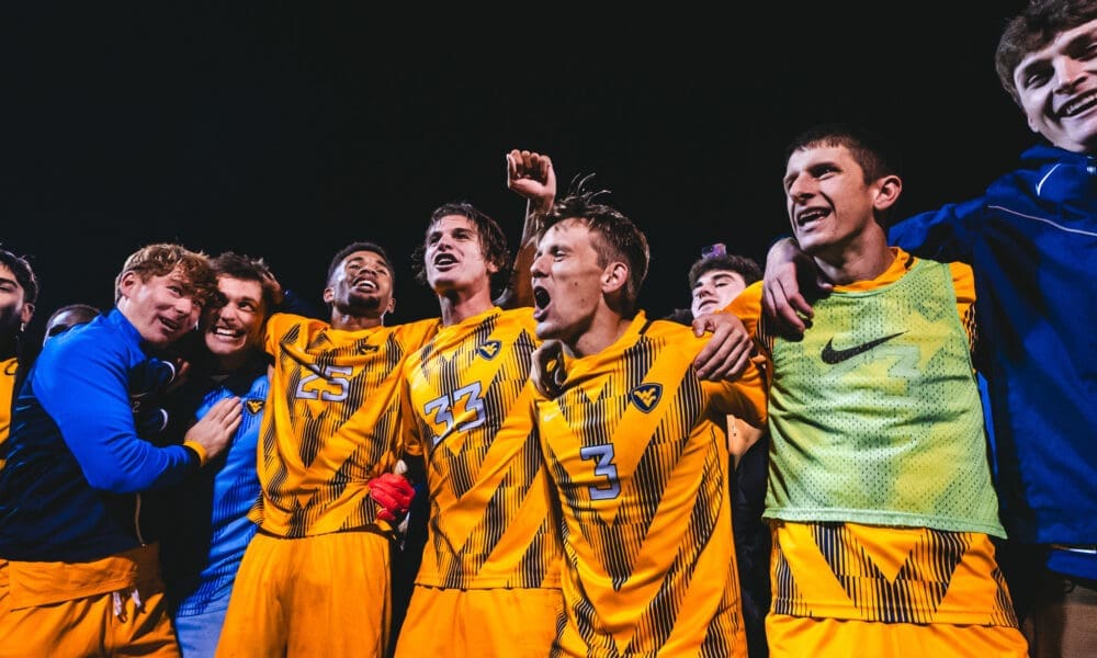 WVU soccer celebrating