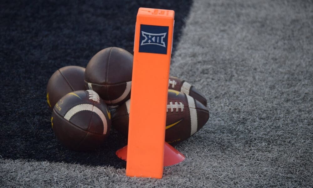WVU Football Big 12 logo with footballs stock