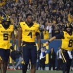 WVU Football Nicco Marchiol, CJ Donaldson, Devin Carter CJ helmet off